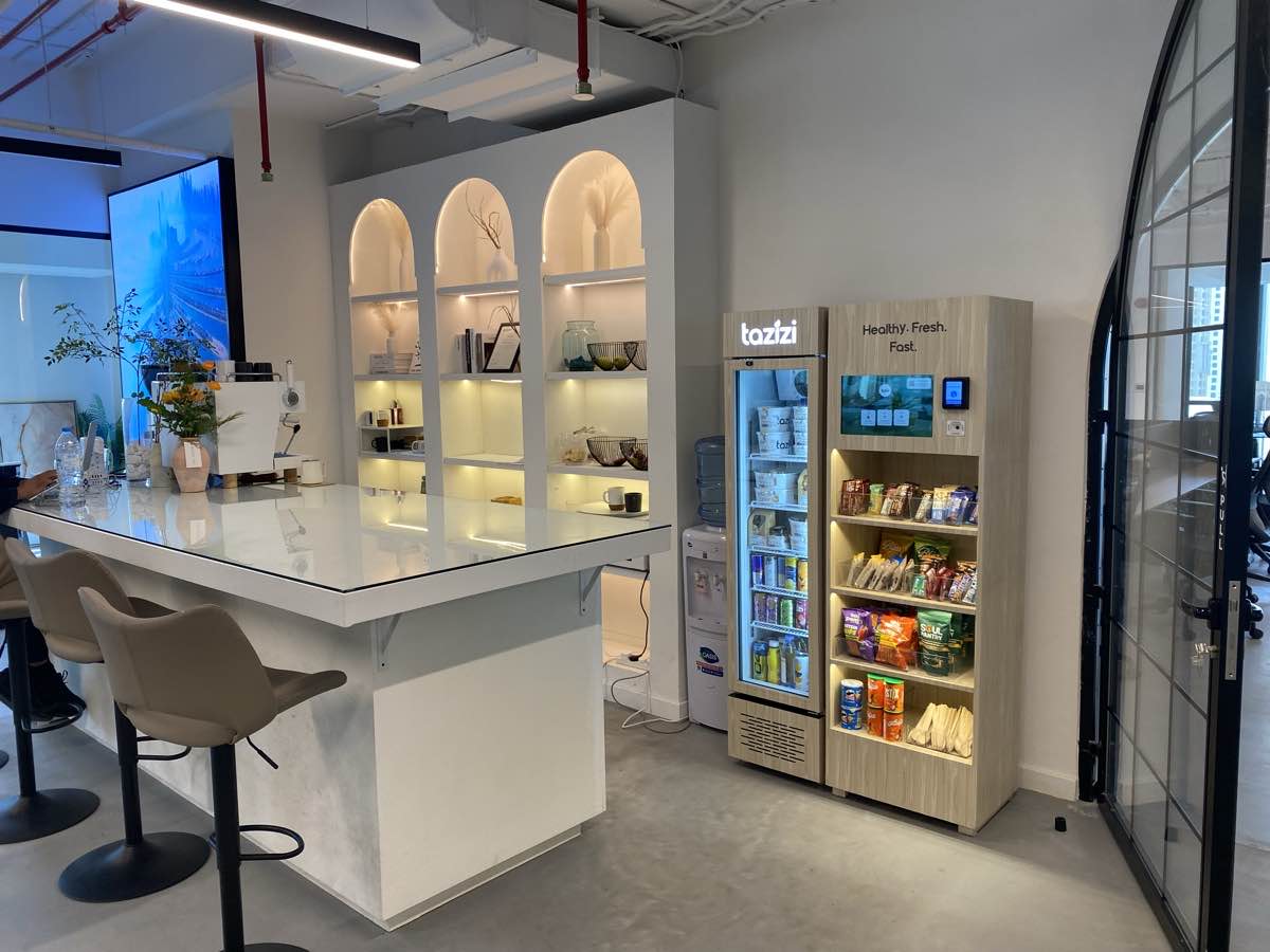 A Tazizi smart fridge stocked with fresh meals in an office pantry